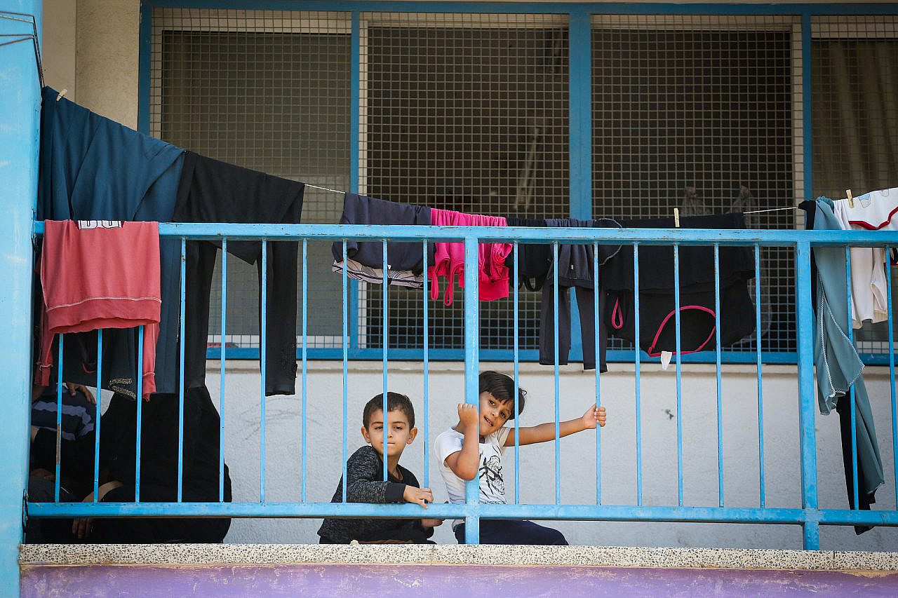 Palestinian children seen at an UNRWA school in Khan Younis, southern Gaza Strip, October 14, 2023. (Atia Mohammed/Flash90)