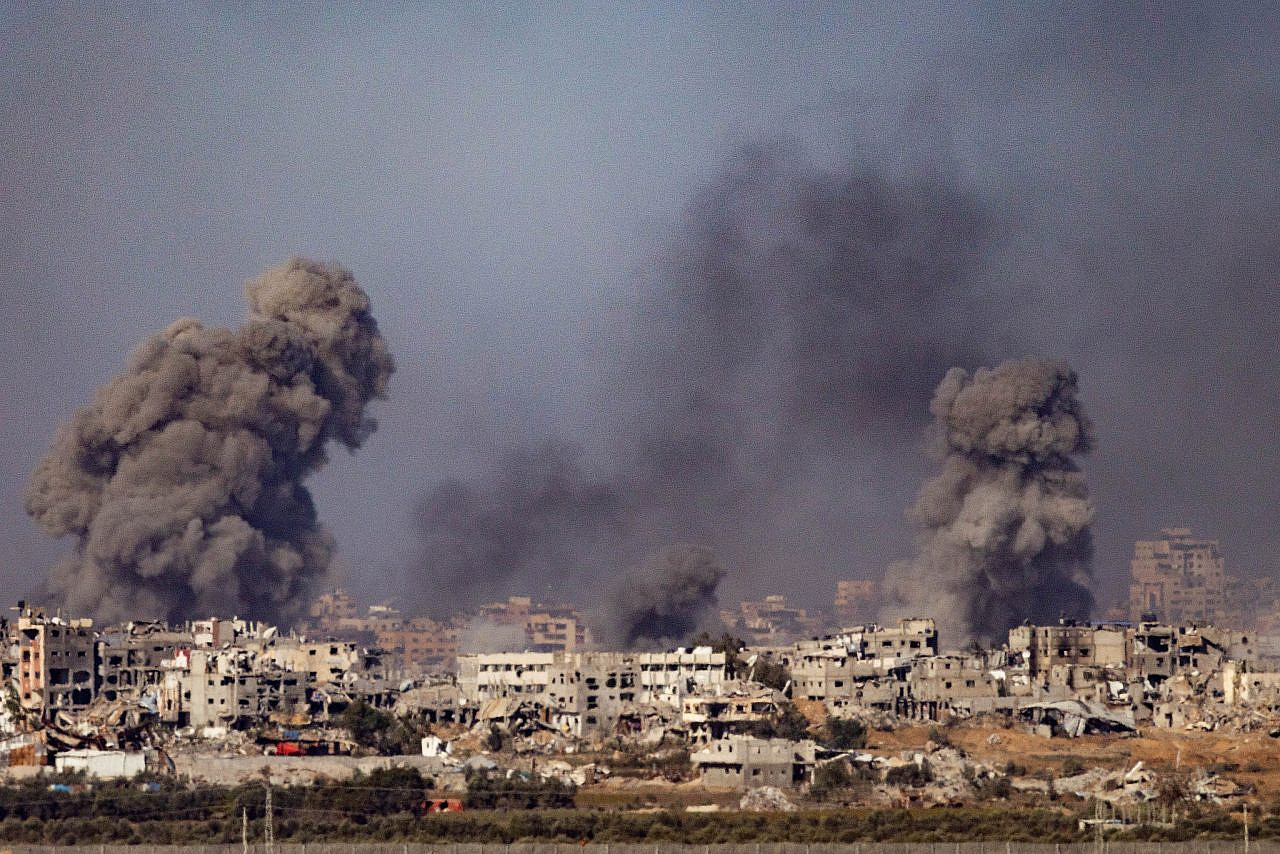 Smoke rises during Israeli airstrikes in the Gaza Strip, as seen from the Israeli side of the fence, December 11, 2023. (Chaim Goldberg/Flash90)