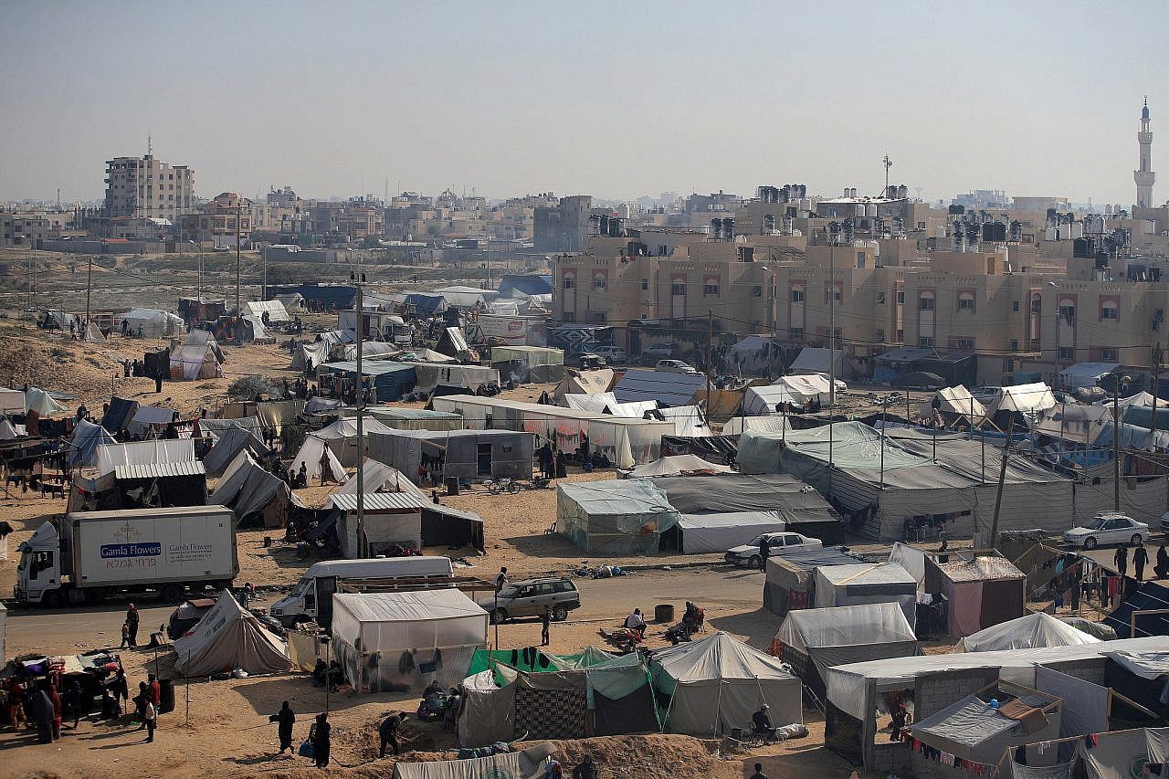Palestinians displaced by Israel's bombardment are seen living in extremely dire conditions in a new tent camp in the Tel al-Sultan area of Rafah, southern Gaza Strip, December 8, 2023. (Mohammed Zaanoun)