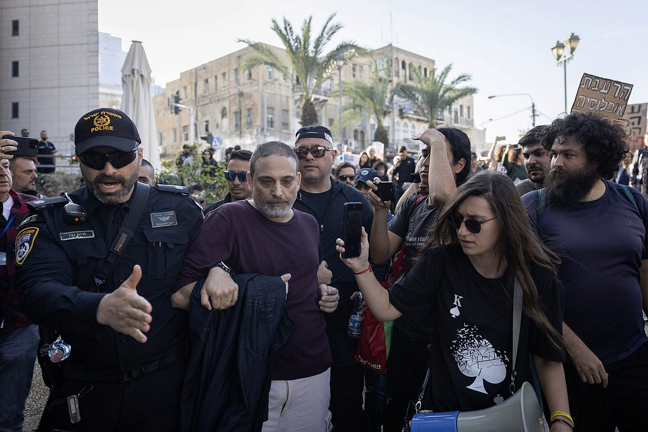 An activist is arrested during a protest against Israel's assault on Gaza, Haifa, January 20, 2024. (Oren Ziv)