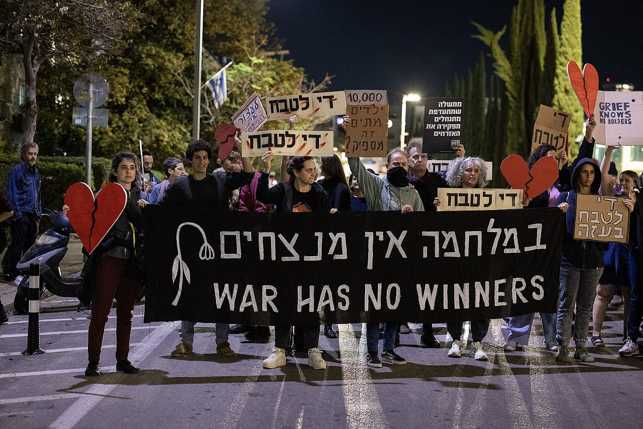 Activists protest against Israel's war on Gaza in Tel Aviv, December 16, 2023. (Oren Ziv)