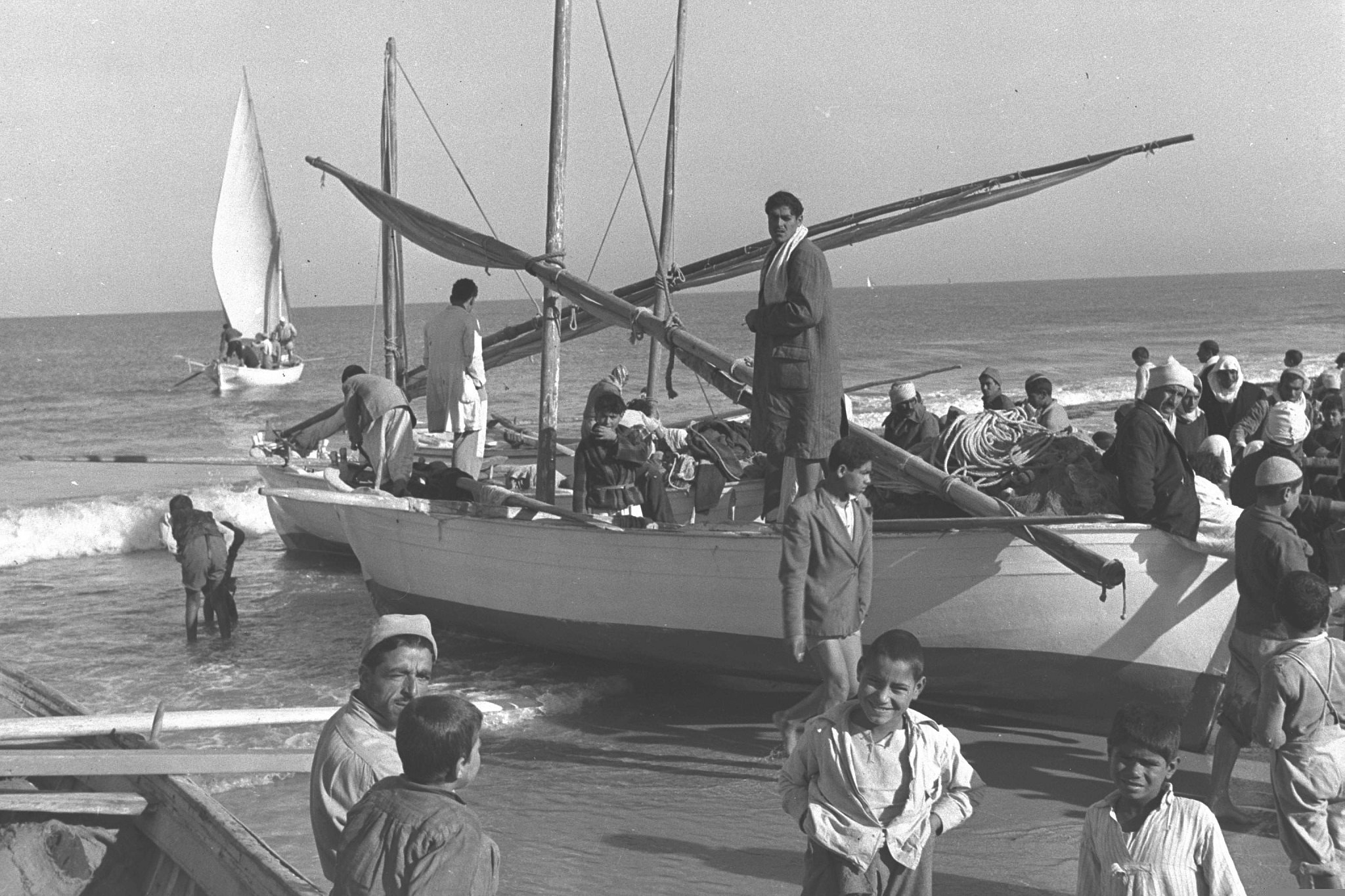 Palestinian fishermen returning from a night of fishing, on the beach in Gaza, February 10, 1957. (Fritz Cohen/GPO)