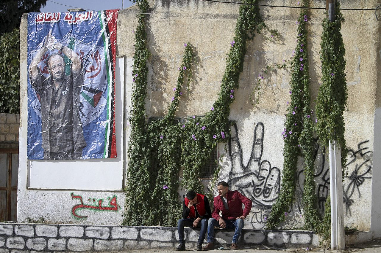 A poster of Marwan Barghouti hangs from a wall in the occupied West Bank city of Nablus, December 7, 2016. (Nasser Ishtayeh/Flash90)