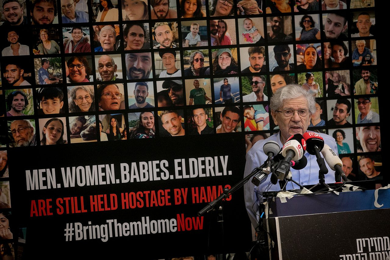 Former Supreme Court President Barak speaks at a press conference held on November 03, 2023, with families whose loved ones have been abducted by Hamas on Oct 7. (Miriam Alster/FLASH90)