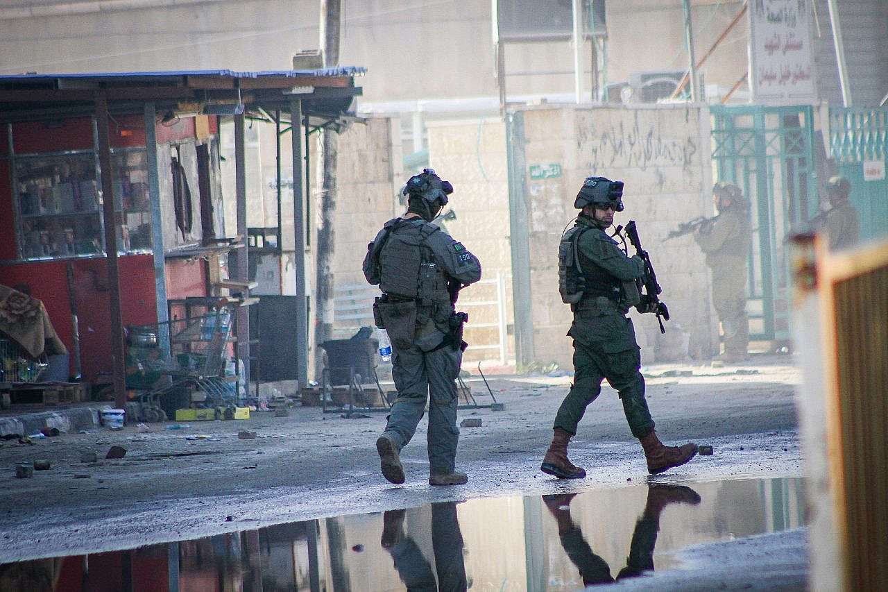 Israeli forces are seen operating in the occupied West Bank city of Jenin, December 14, 2023. (Nasser Ishtayeh/Flash90)