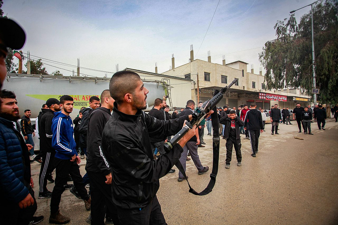 Palestinian gunmen are seen after an Israeli military raid into the occupied West Bank city of Tulkarem, December 17, 2023. (Nasser Ishtayeh/Flash90)