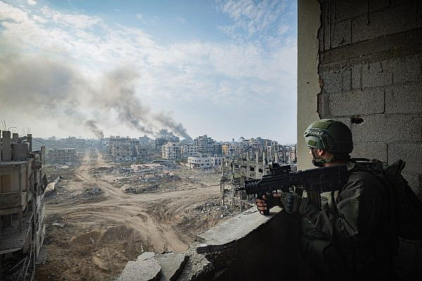 Israeli soldiers from the 8717 Battalion of the Givati Brigade operating in Beit Lahia, in the northern Gaza Strip, during a military operation, December 28, 2023. (Yonatan Sindel/Flash90)