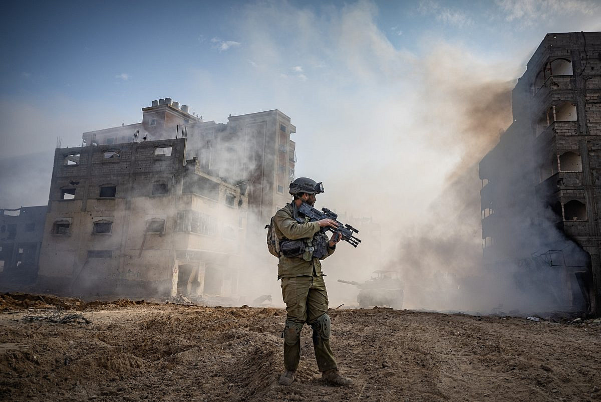 Israeli soldiers from the 8717 Battalion of the Givati Brigade operating in Beit Lahia, in the northern Gaza Strip, during a military operation in the Gaza Strip, December 28, 2023. (Yonatan Sindel/Flash90)