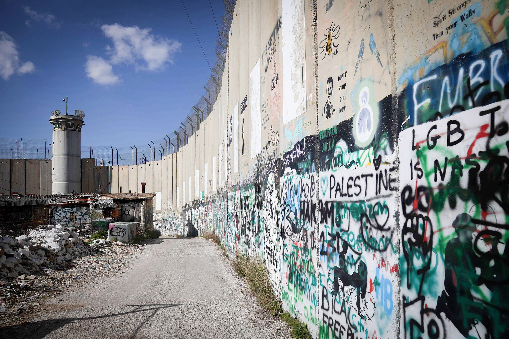 View of graffiti painted by artists supporting the Palestinians, seen painted on the separation wall in the West Bank city of Bethlehem, January 16, 2024. (Wisam Hashlamoun/Flash90)