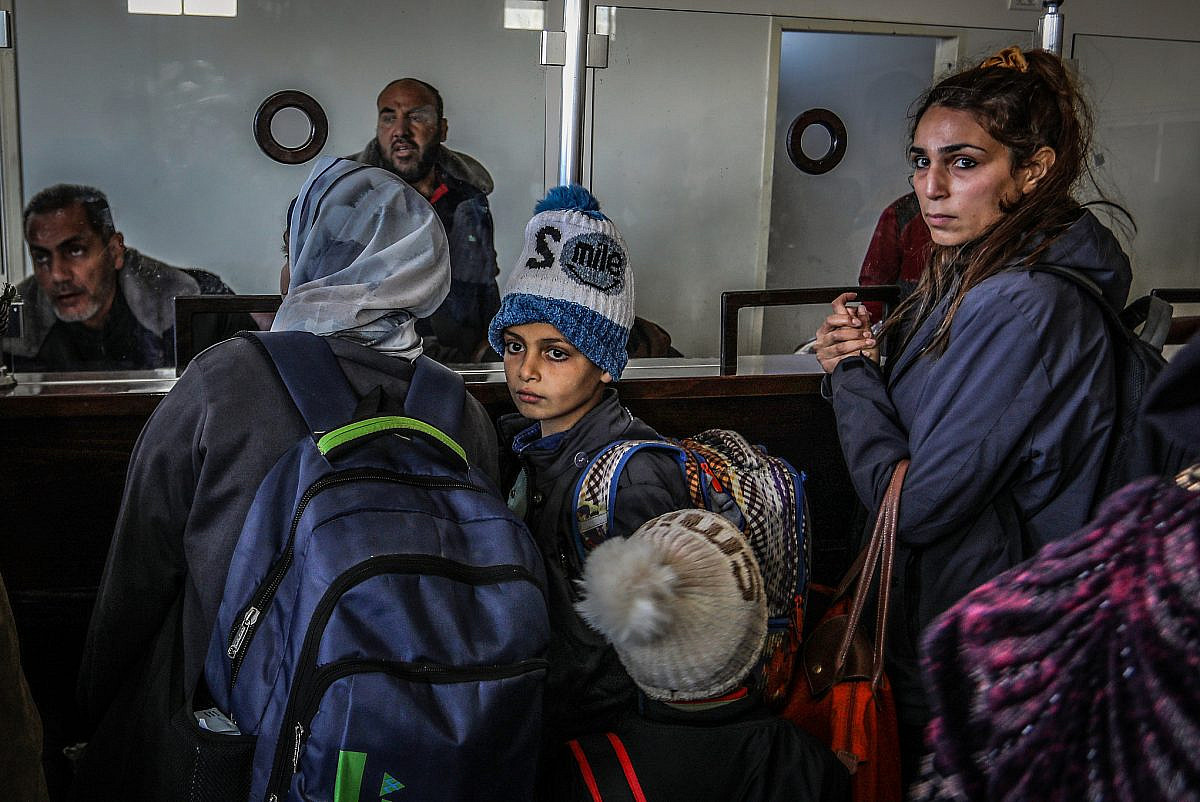 Palestinians with foreign passports leave Gaza to Egypt via the Rafah Crossing, southern Gaza Strip, February 6, 2024. (Abed Rahim Khatib/Flash90)
