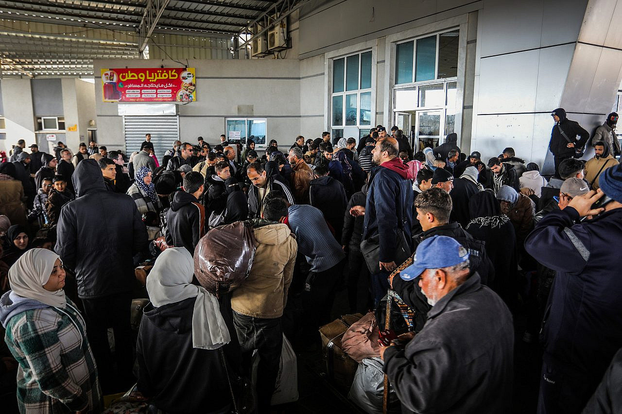 Palestinians with foreign passports leave Gaza to Egypt via the Rafah Crossing, southern Gaza Strip, February 6, 2024. (Abed Rahim Khatib/Flash90)