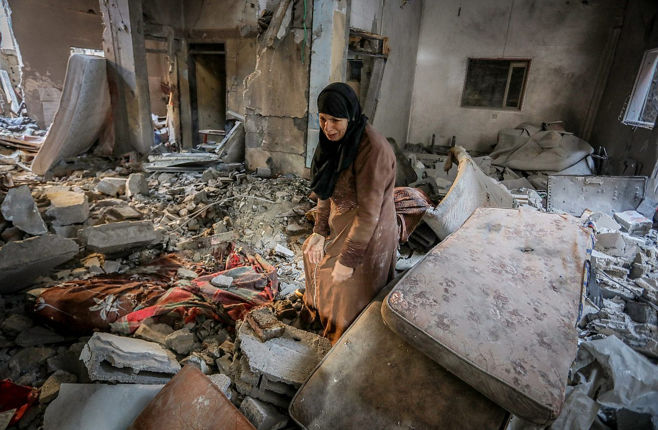 Palestinians inspect their destroyed house after an Israeli airstrike in Rafah, southern Gaza Strip, February 8, 2024. (Abed Rahim Khatib/Flash90)