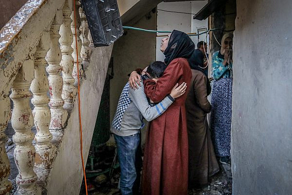 Palestinians inspect their destroyed house after an Israeli airstrike in Rafah, southern Gaza Strip, February 8, 2024. (Abed Rahim Khatib/Flash90)