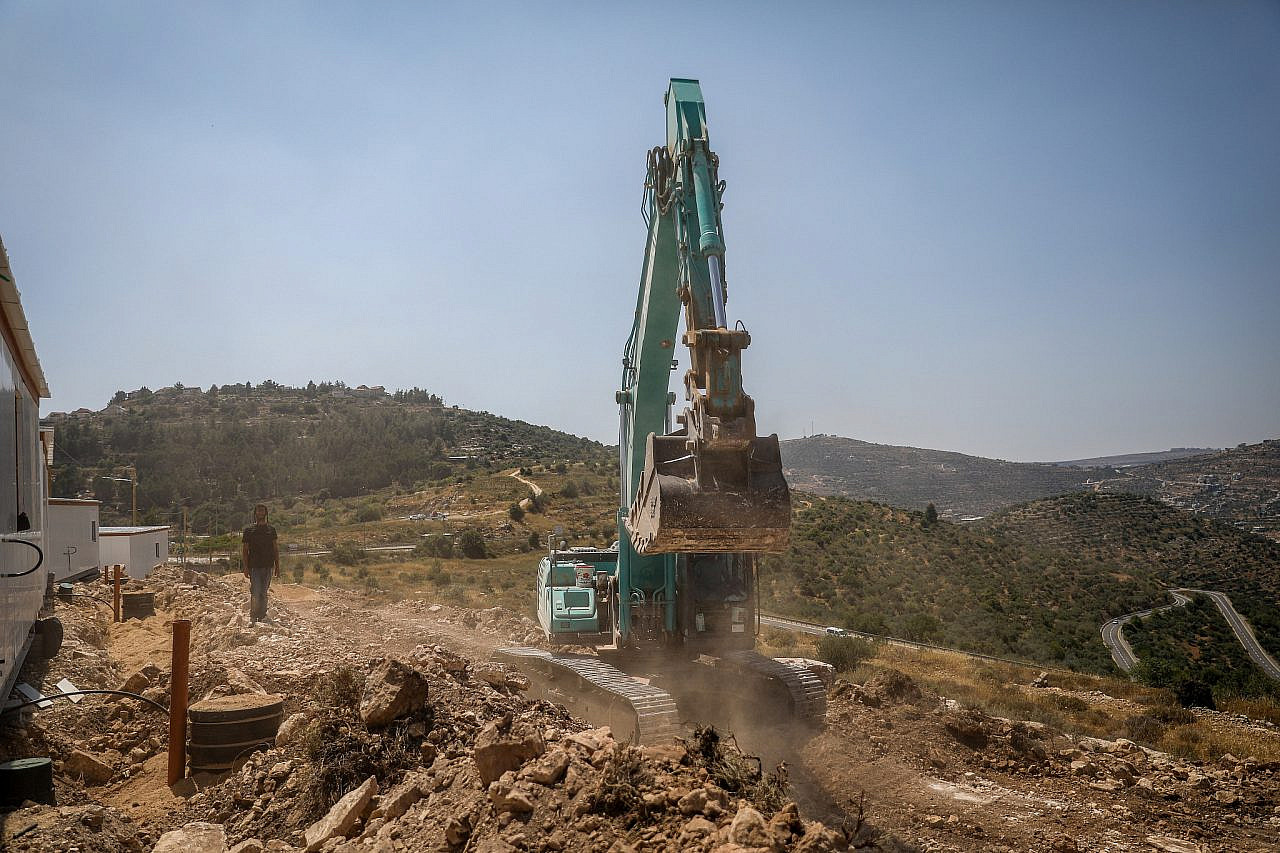 Excavators break ground during construction in a new outpost in the Binyamin area, occupied West Bank, June 22, 2023. (Flash90)