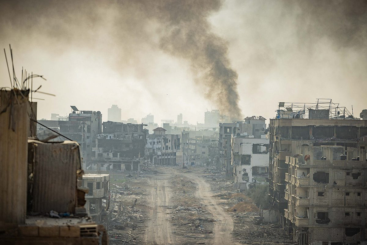 Smoke rises after Israeli airstrikes in Beit Lahia, in the northern Gaza Strip, December 28, 2023. (Yonatan Sindel/Flash90)