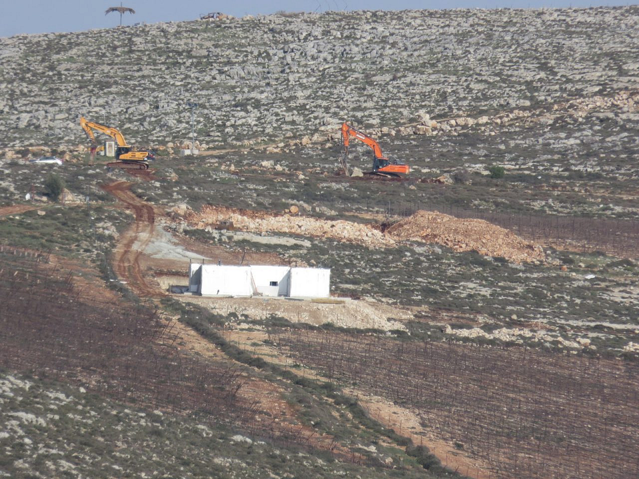 Settler construction work is seen near the village of Qaryut, occupied West Bank, January 2024. (Bashar al-Qaryuti)