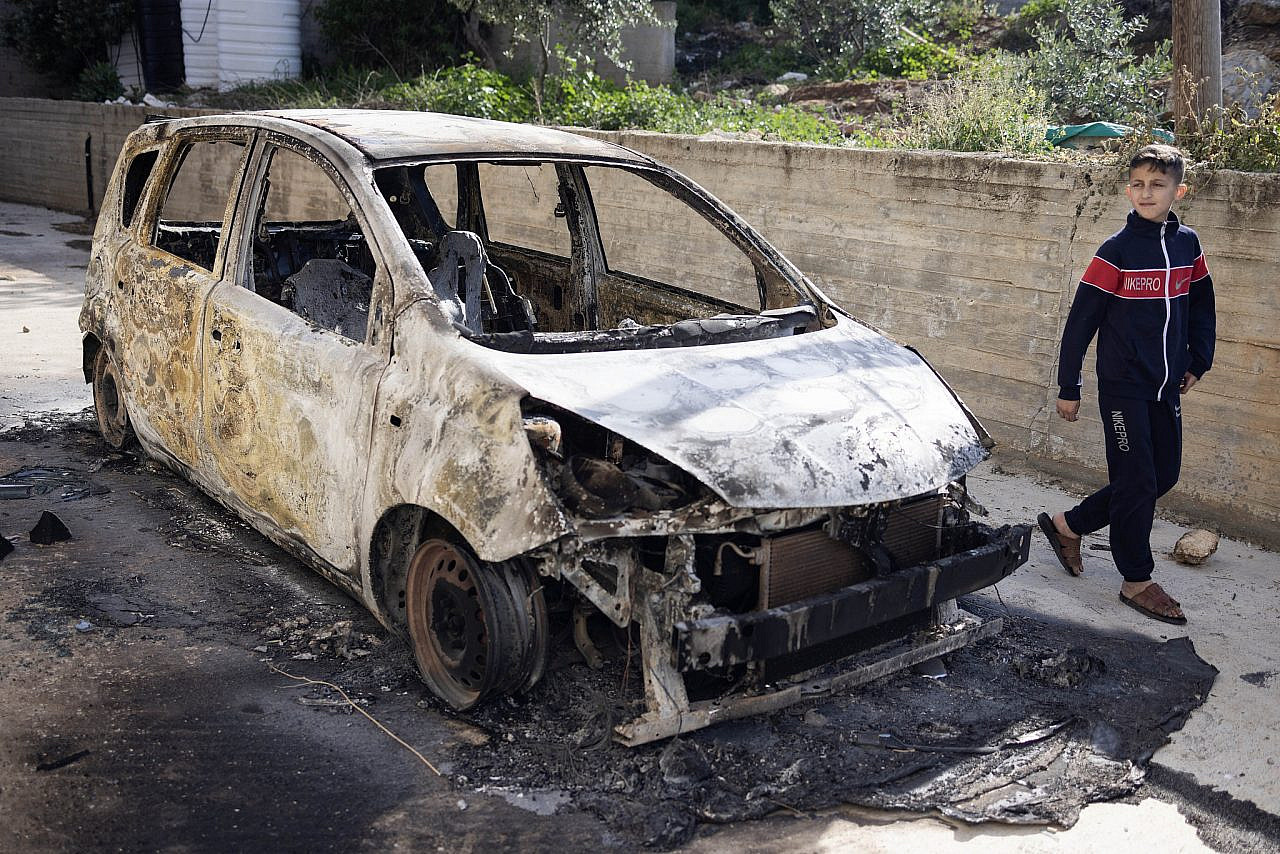 The remains of a car that was burned by settlers during a pogrom in Duma, occupied West Bank, April 14, 2024. (Oren Ziv)