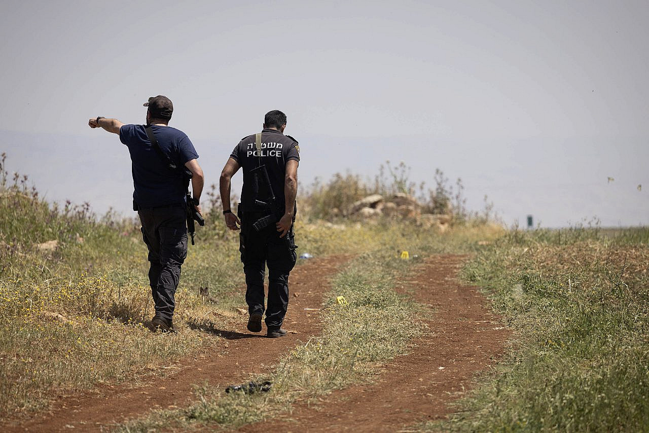 Police investigate the scene of a settler attack in Khirbet al-Tawil, east of the town of Aqraba near Nablus, occupied West Bank, April 16, 2024. (Oren Ziv)
