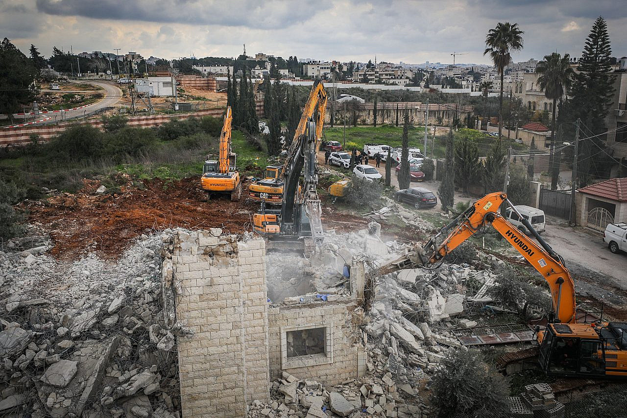 Israeli security forces demolish a building that was built without a permit in the East Jerusalem neighborhood of Beit Hanina, February 20, 2024. (Jamal Awad/Flash90)