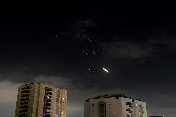 Anti-missile system fires interception missiles as drones and missiles are fired from Iran, as seen over Tel Aviv, April 14, 2024. (Tomer Neuberg/Flash90)