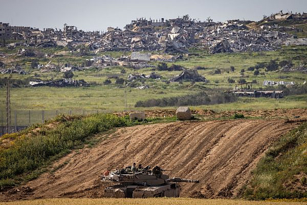 An Israeli tank seen near the Gaza border fence, March 26, 2024. [Chaim Goldberg/Flash90]