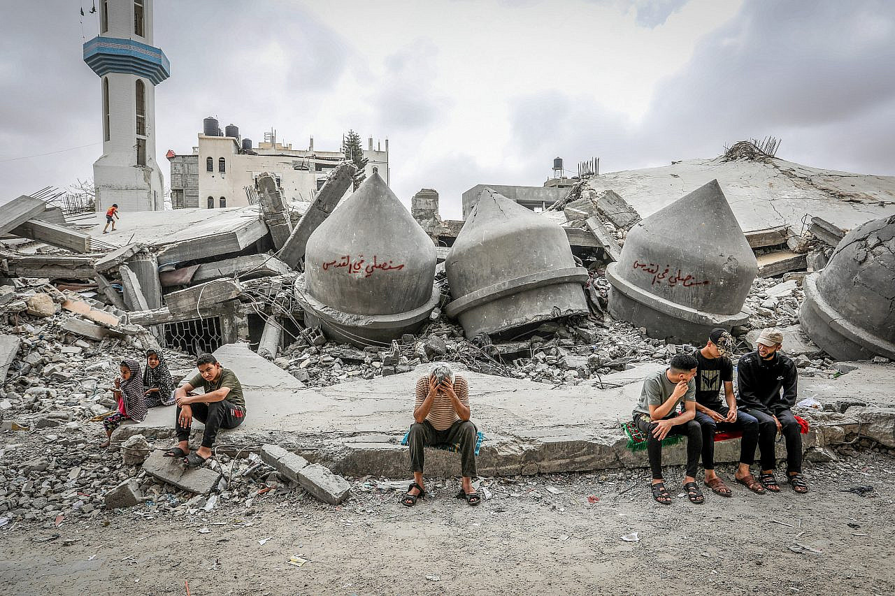 Palestinians at the site of a mosque destroyed in an Israeli airstrike, near the Shaboura refugee camp in Rafah, southern Gaza Strip, April 26, 2024. (Abed Rahim Khatib/Flash90)