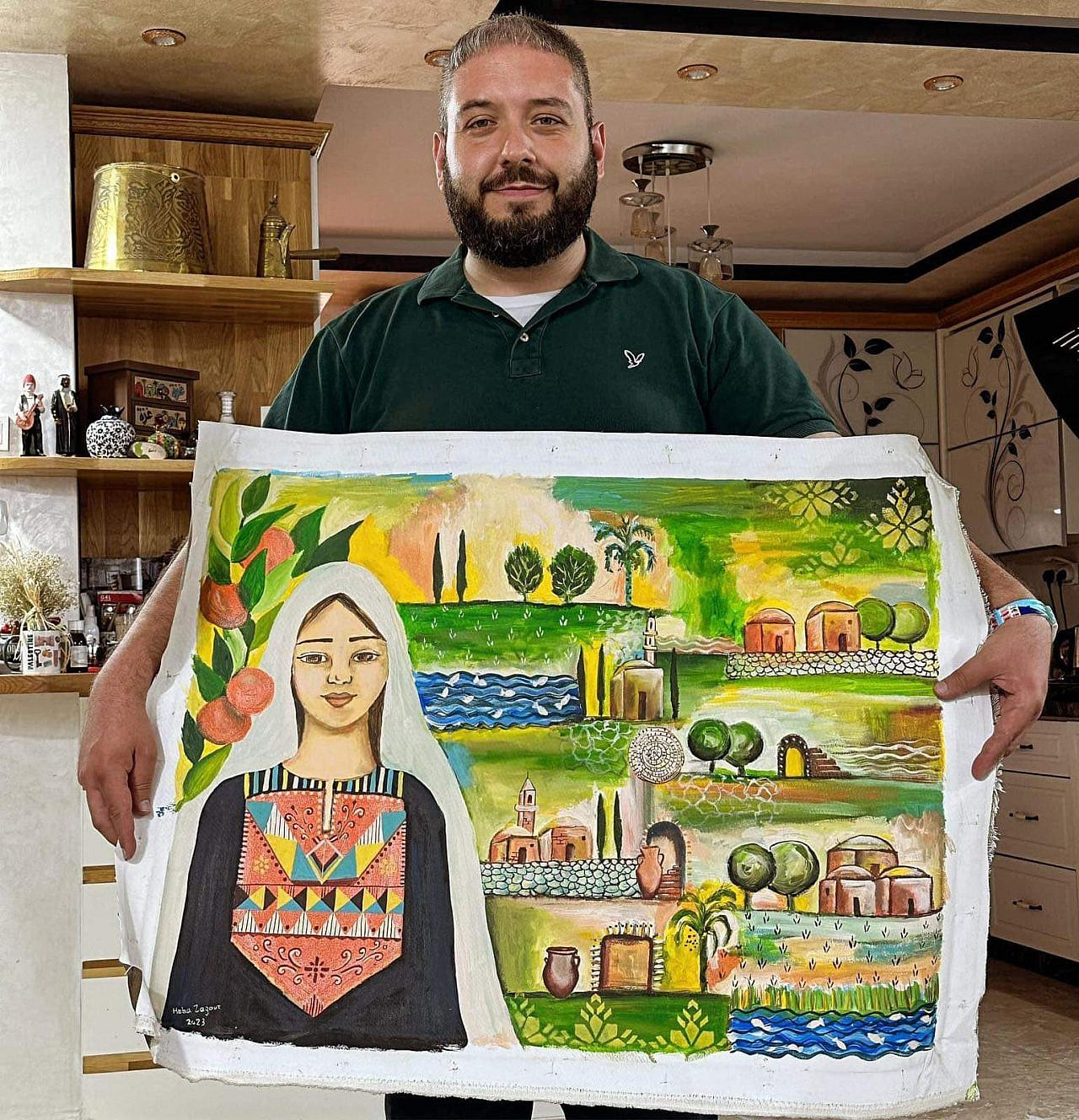 Chris Whitman holds the artwork "Asdood" by Heba Zagout. (Courtesy of Chris Whitman)
