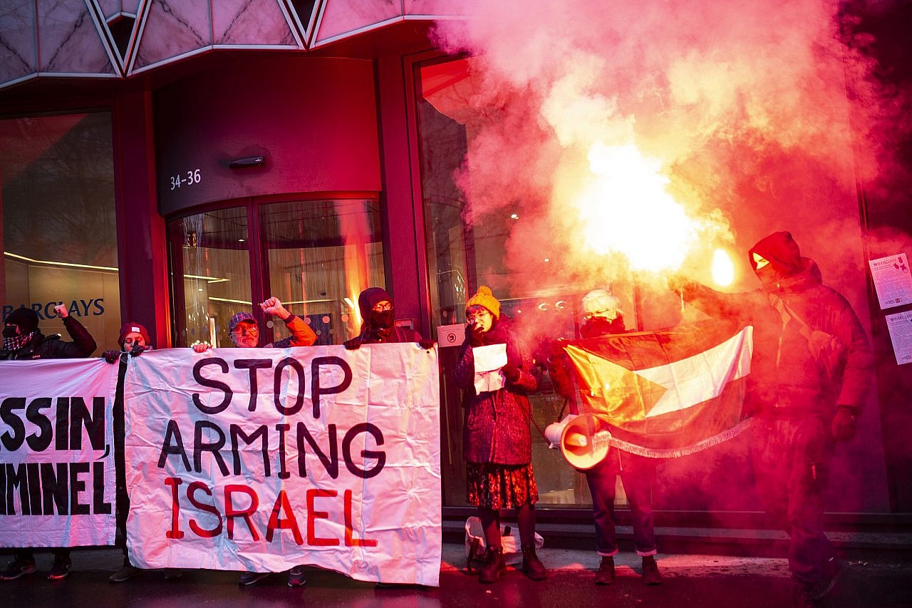 Palestine solidarity activists demonstrate in front of the British bank Barclays in Paris, France, to protest against the bank's massive investment in Israeli arms and security companies, among them Elbit Systems, January 15, 2024. (Anne Paq/Activestills)