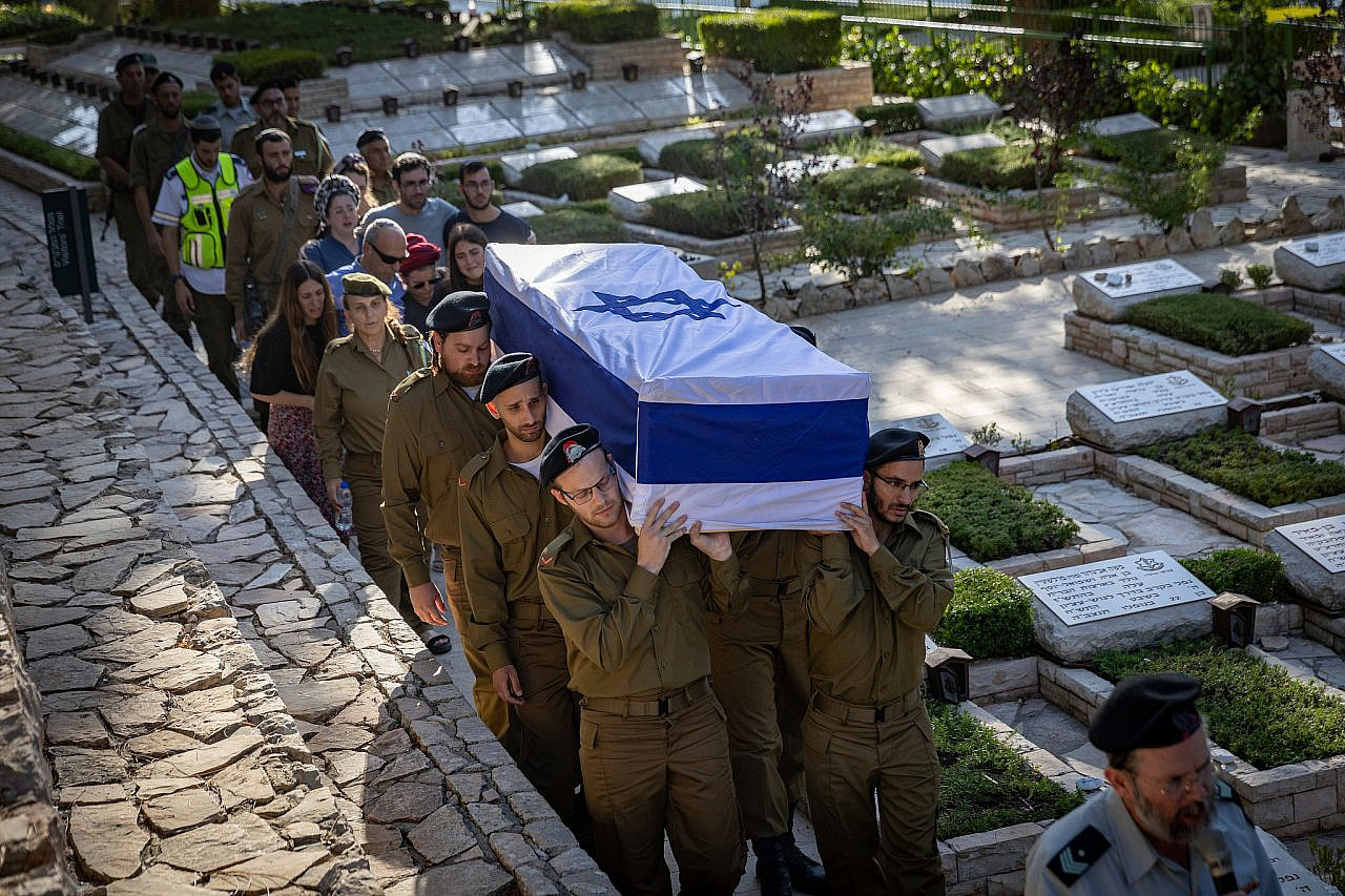 Family and friends of Israeli soldier Malkia Gross, killed in combat in Gaza, attend his funeral at the Mount Herzl Military Cemetery in Jerusalem, June 24, 2024. (Noam Revkin Fenton/Flash90)