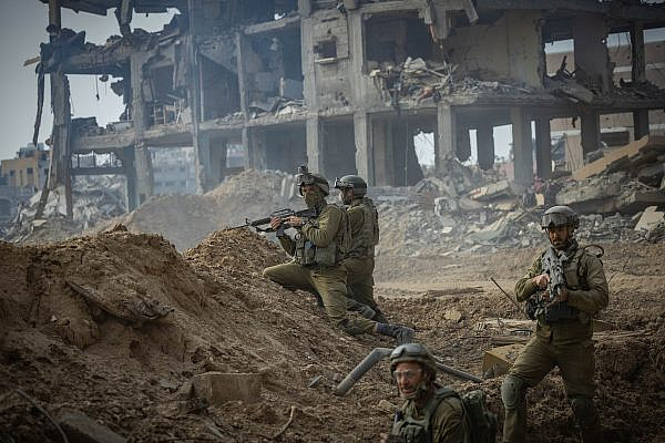 Israeli soldiers from the 8717 Battalion of the Givati Brigade operating in Beit Lahia, northern Gaza Strip, December 28, 2023. (Yonatan Sindel/Flash90)