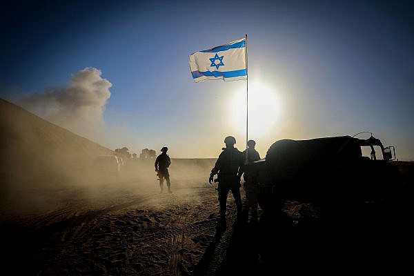Israeli soldiers seen on the Israeli side of the Gaza fence, March 4, 2024. (Jamal Awad/Flash90)