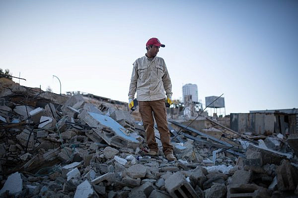 Eid al-Hathaleen stands atop the rubble of his home after it was demolished by the Israeli Civil Administration, Umm al-Khair, occupied West Bank, July 7, 2024. (Emily Glick)
