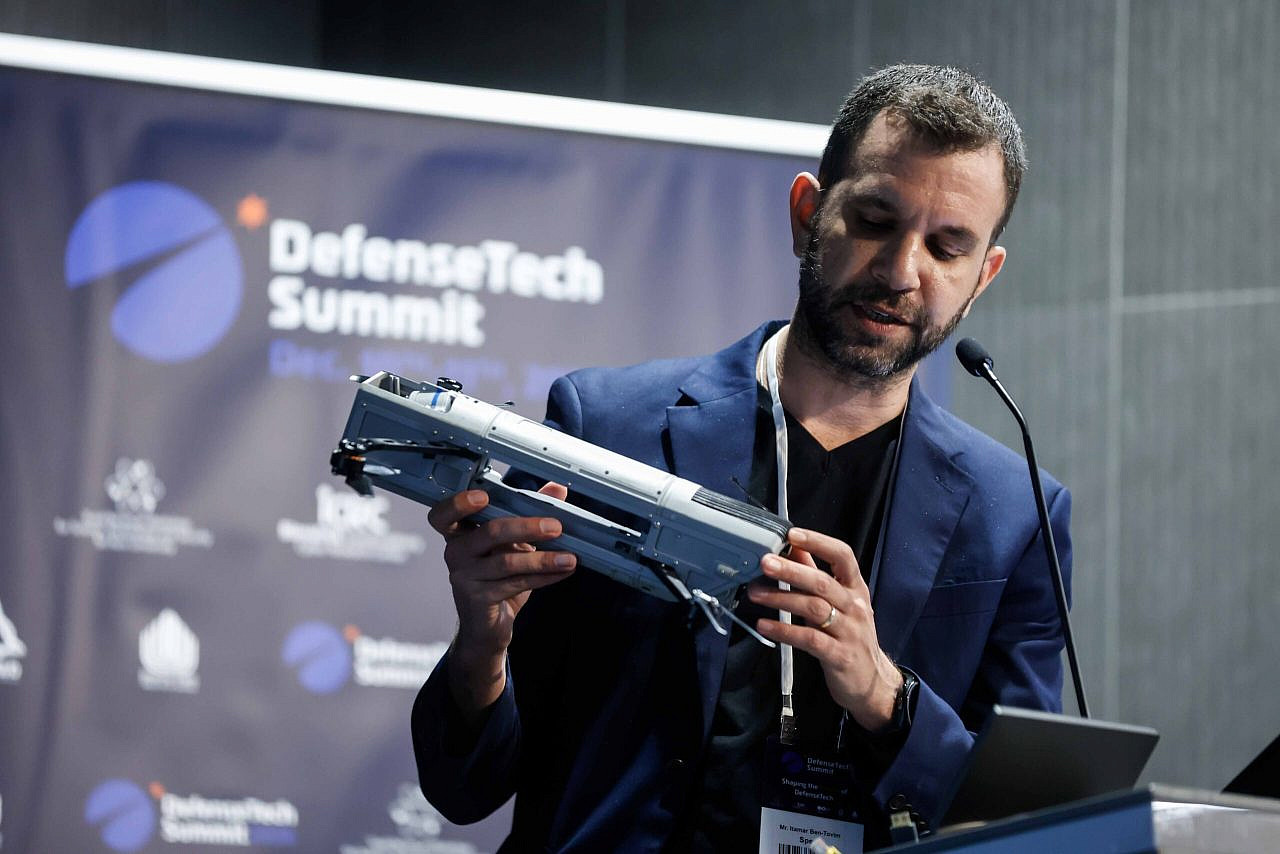 Itamar Ben-Tovim, CBDO at SpearUAV, showcasing the company's new product, at DefenseTech Summit, Tel Aviv, December 10, 2024 (DefenseTech Summit)