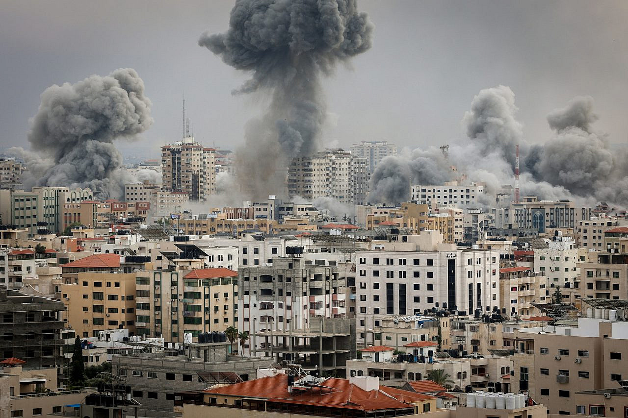 Fire and smoke rise during Israeli airstrikes on the Gaza Strip, October 9, 2023. (Atia Mohammed/Flash90)