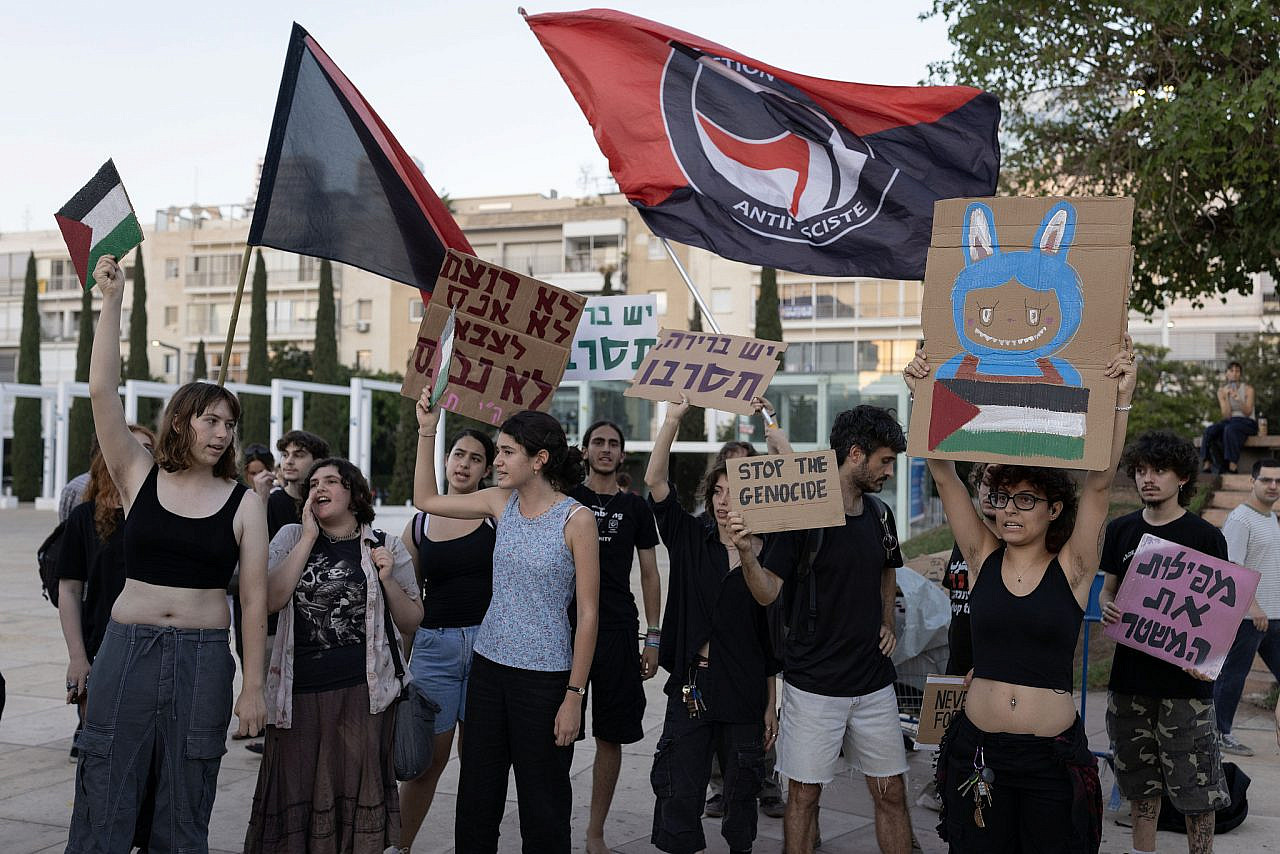 Young Israelis burning their draft notices in protest of the genocide in Gaza, in Tel Aviv, July 15, 2025. (Oren Ziv)