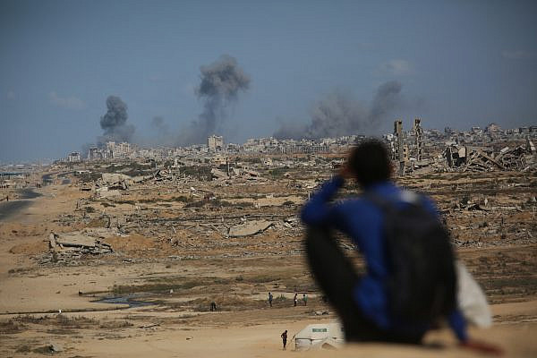 Smoke rises following an Israeli military strike in Gaza City, as seen from the central Gaza Strip, October 6, 2025. (Ali Hassan/Flash90)
