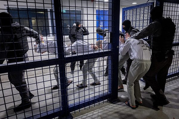 Israel Prison Service officers prepare Palestinian prisoners for release as part of a hostage deal between Israel and Hamas, at Kteziot Prison, southern Israel, February 26, 2025. (Chaim Goldberg/Flash90)