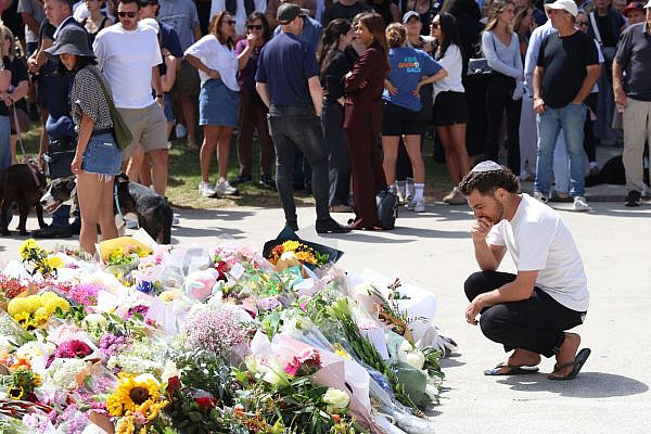 People gather at a memorial at Bondi Beach to mourn those killed in a mass shooting attack, in Sydney, Australia, Dec. 15, 2025. (Marcin Cholewinski/ZUMA Press Wire)