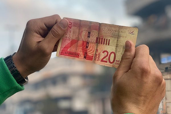 A worn-out banknote in Gaza, Dec. 19 2025. (Ahmed Ahmed)