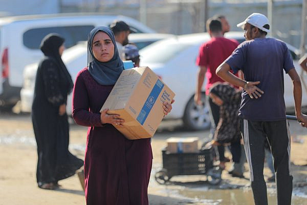 World Food Programme (WFP) provides food parcels to displaced people in Gaza City, October 23, 2025. (Ali Hassan/Flash90)