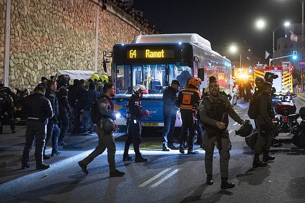 Security and rescue forces are seen at the scene where an ultra-Orthodox teenager was killed and three others were wounded after being hit by a bus during a mass demonstration against the enlistment of ultra-Orthodox Jews to the Israeli army, Jerusalem, January 6, 2026. (Chaim Goldberg/Flash90)