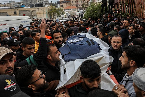 Family members and colleagues carry the bodies of Palestinian journalists killed in an Israeli strike as they arrive at Nasser Hospital in Khan Younis, in the southern Gaza Strip, Jan. 21, 2026. (Abed Rahim Khatib/Flash90)