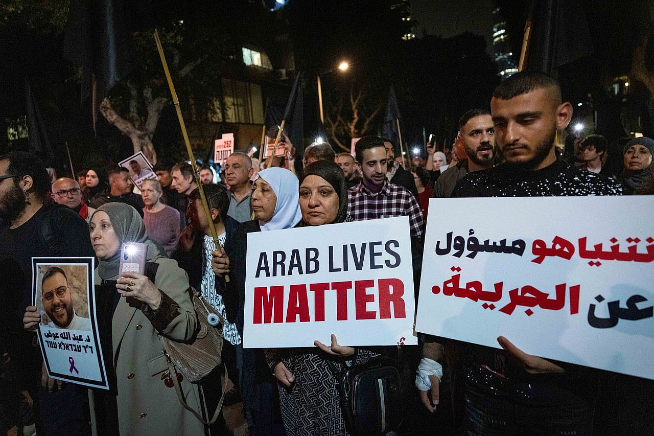 Palestinian and Jewish citizens of Israel attend a protest against rising violent crime in Palestinian society, in Tel Aviv, January 31, 2026. (Yonatan Sindel/Flash90)
