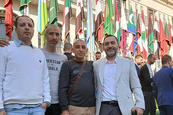Freed Palestinian prisoners exiled to Egypt stand in front of the Arab League Headquarters in Cairo, Egypt, December 2025. From left to right: Raed Abdul Jalil, Rami Nour, Kamil Abu Hanish, Ammar Al-Zaben. (Courtesy)