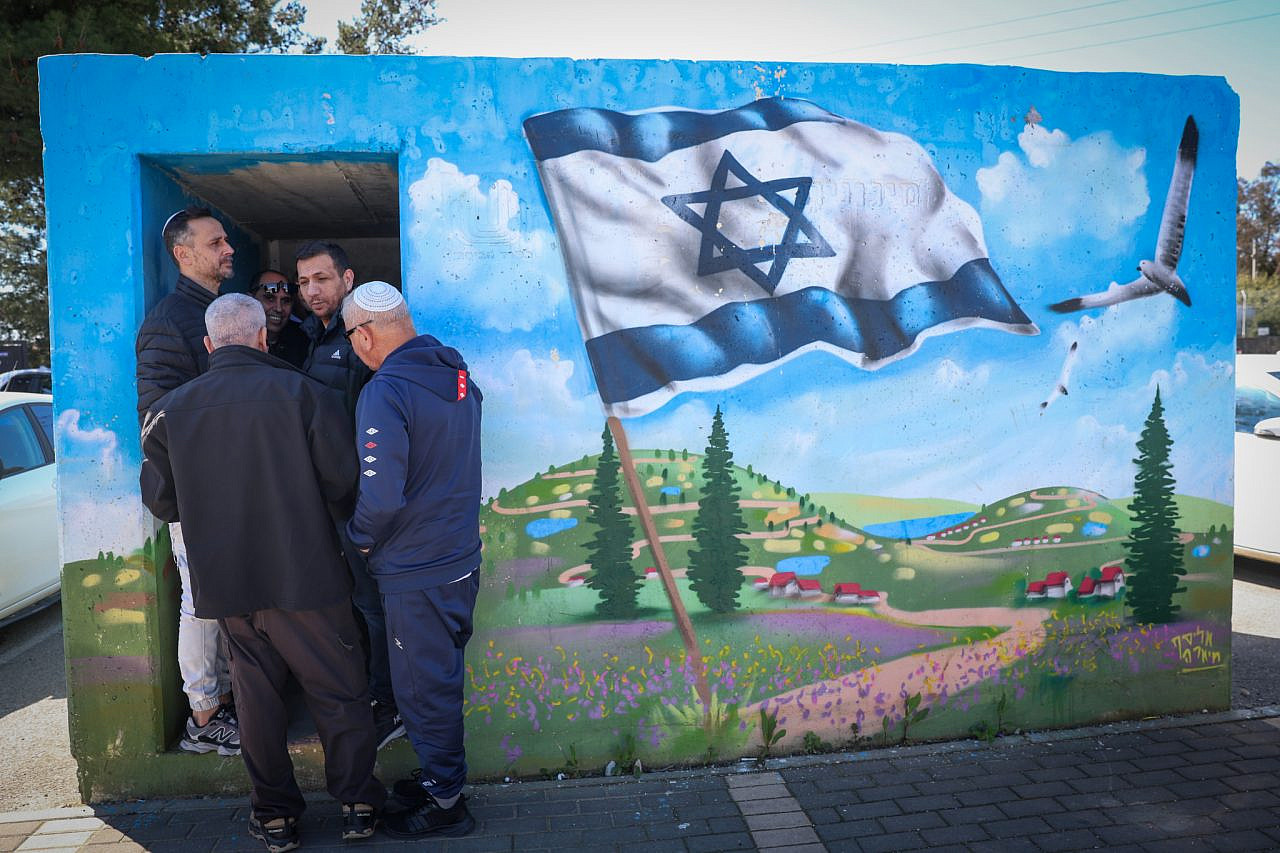 Israelis take cover in a public shelter in Tzfat as a siren sounds warning of incoming ballistic missiles fired from Iran toward Israel, March 1, 2026. (David Cohen/Flash90)