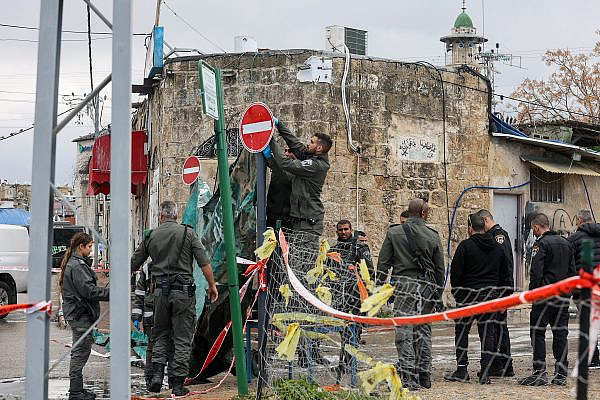 Police officers at the scene where a Palestinian man was killed in a car bomb in Lod, central Israel, February 15, 2023. (Jonathan Shaul/Flash90)