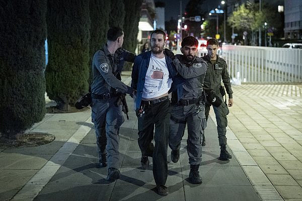 Police officers arrest a demonstrator at a rally against Israel's war with Iran, at Habima Square, Tel Aviv, March 28, 2026. (Flash90)