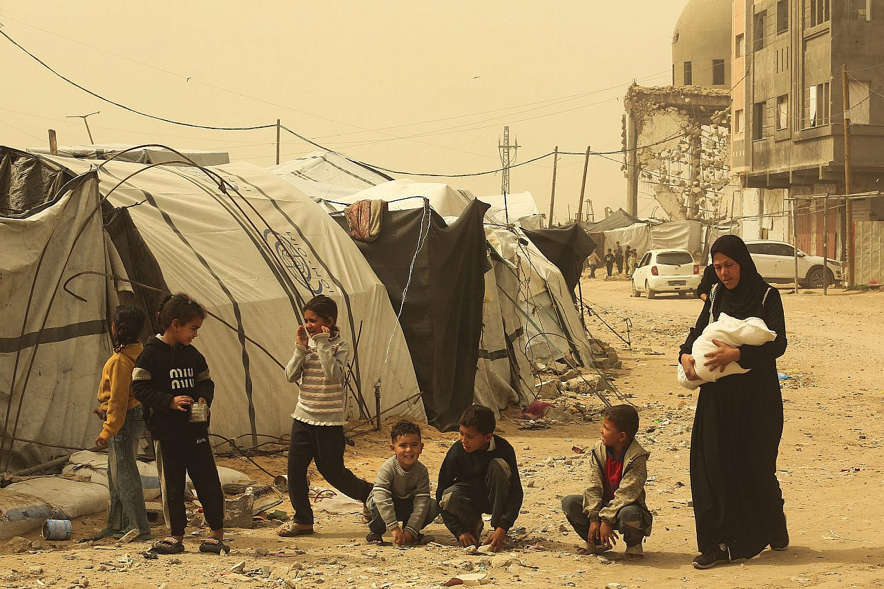 Palestinians who lost their homes in the recent war are seen near their tents in Khan Yunis, in the Southern Gaza Strip, April 3, 2026. (Abed Rahim Khatib/Flash90)