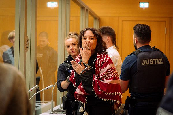 Leandra Rollo seen behind a glass screen at the trial of the Palestine Action 'Ulm 5,' charged with breaking into Elbit's offices in southern Germany, at the Stannheim prison complex near Stuttgart, April 27, 2026. (Ignacio Rosaslanda)