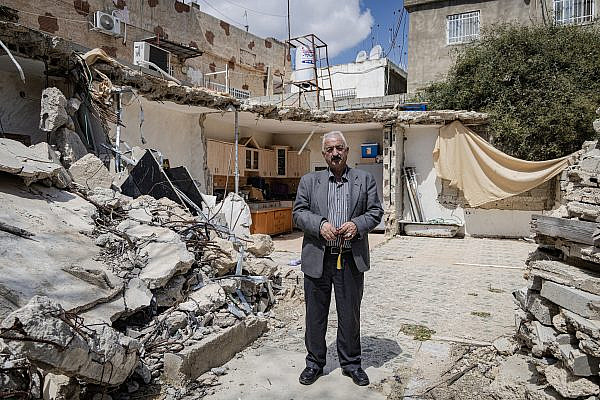 Fakhri Abu Diab, beside the rubble of his house that the Jerusalem Municipality demolished in 2024, Al-Bustan, Silwan, occupied East Jerusalem. (Faiz Abu Rmeleh)